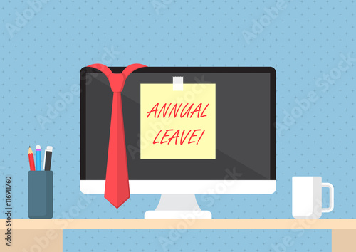 Sticky note with word annual leave on monitor