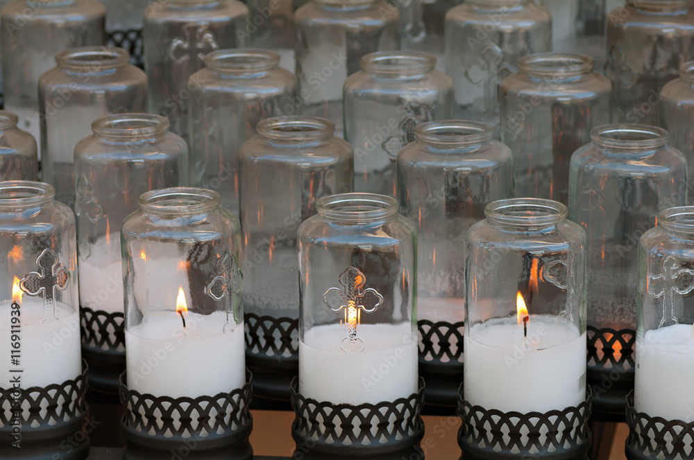 Votive candles in a catholic church. Stock Photo | Adobe Stock