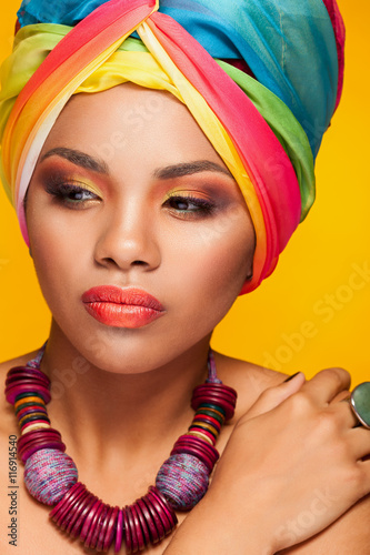Beautiful ethnic afrom american young model wearing a turban