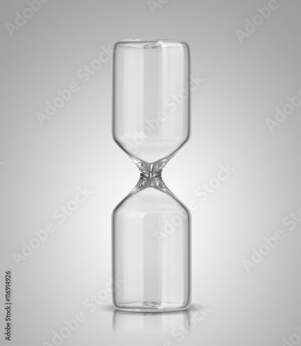 Empty hourglass on gray background