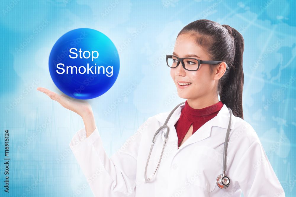 Female doctor holding blue crystal ball with stop smoking sign on medical background. Female doctor holding blue crystal ball with stop smoking sign on medical background.