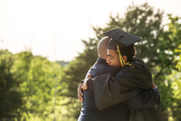 African American father and son at graduation.