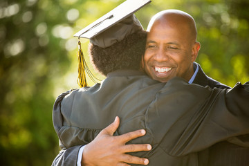 African American father and son at graduation.