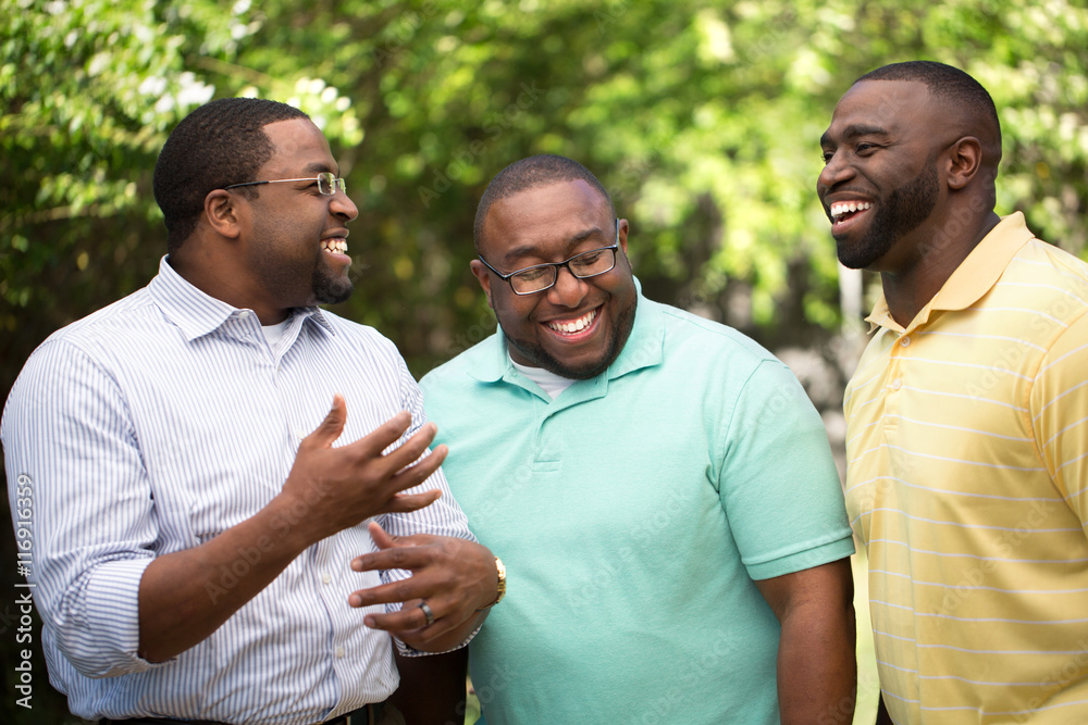 Brothers hanging out talking and laughing.