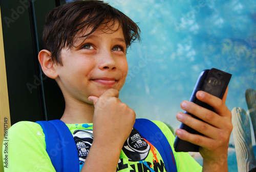 boy using smartphone photo