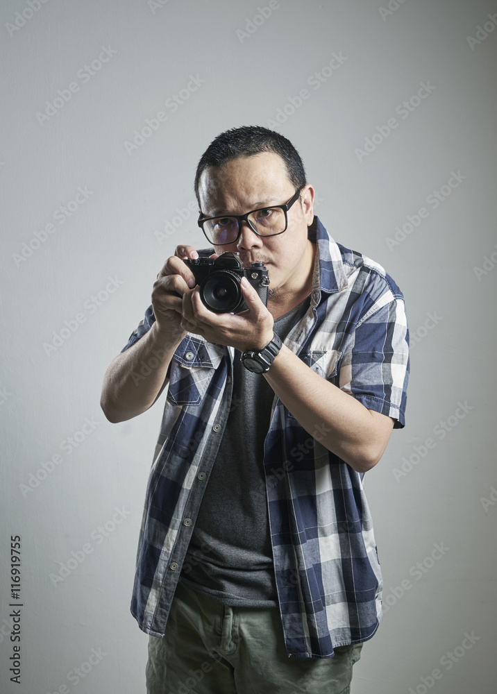 Asian Photographer taking a picture Asian Photographer taking a picture