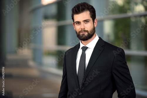 Headshot pose portrait of a modern attractive business man with a beard   © elnariz