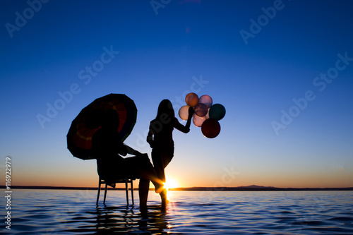 Turkey Salt lake sunset silhouette umbrella woman photo