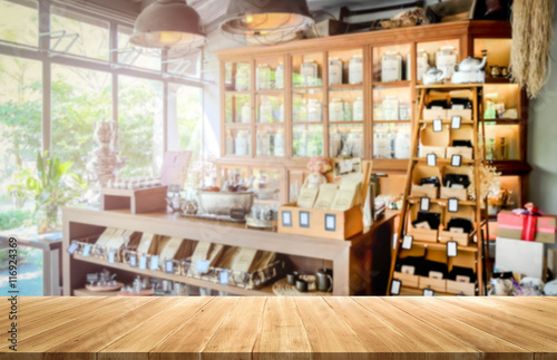 Empty wood table and blurred coffee shop background. product display photo