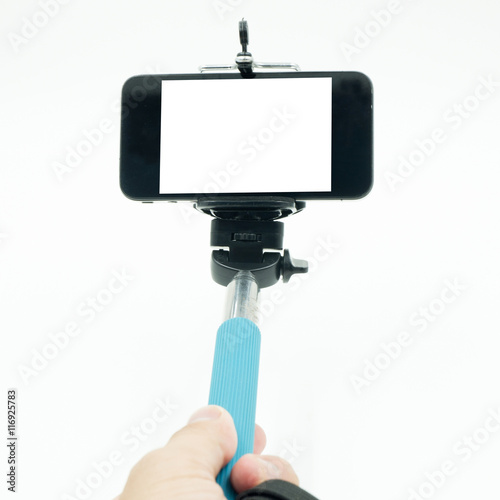 taking selfie - hand hold monopod with mobile phone