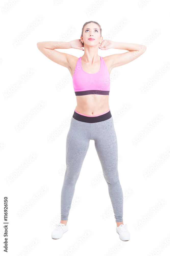 Young female doing exercises in gym class Young female doing exercises in gym class