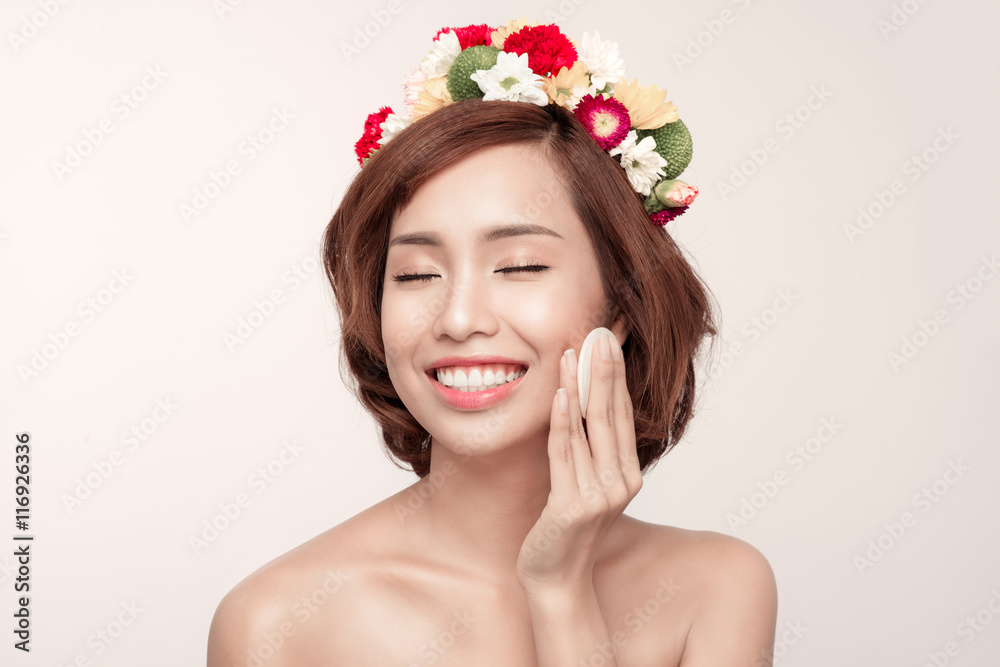 Beauty concept. Beautiful brunette lady removing makeup from her Beauty concept. Beautiful brunette lady removing makeup from her