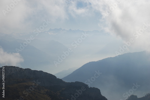 Misty view mountains Swiss alps