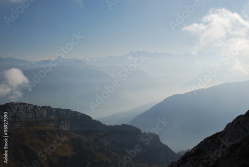 Misty and cloudy view mountains Swiss alps