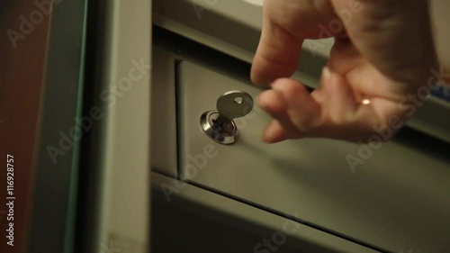 Key unlocked a safe latch and opening door safety deposit box
