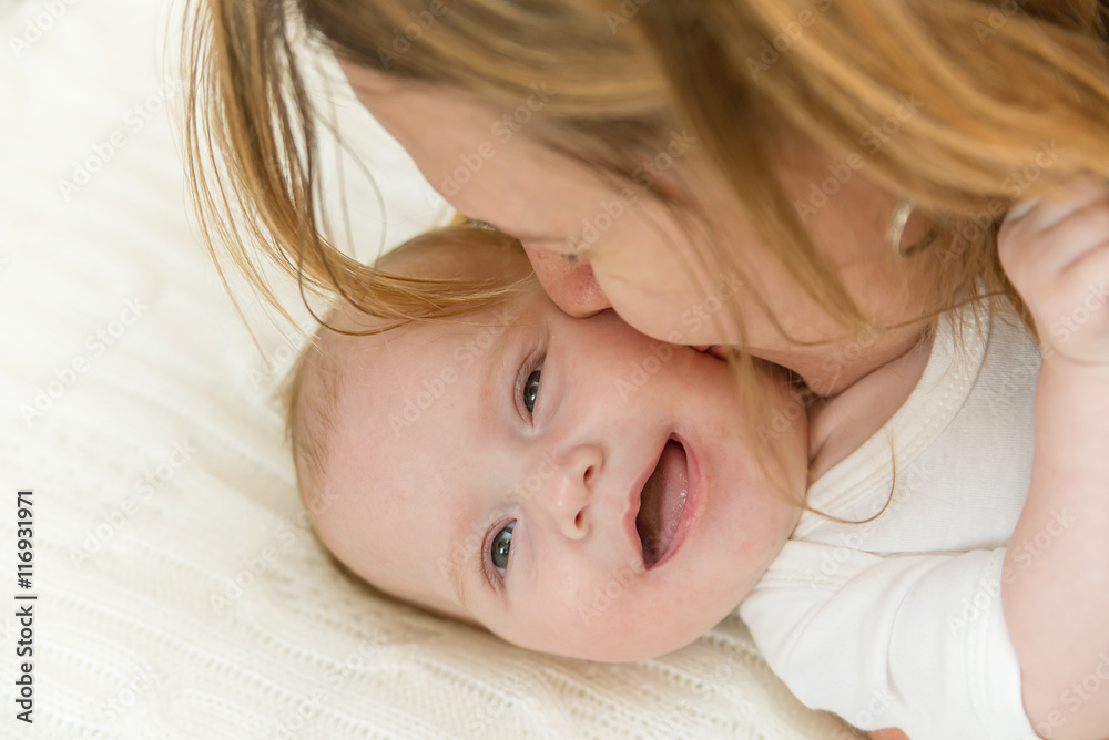 Smiling newborn baby and mother Smiling newborn baby and mother