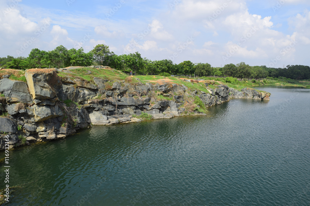 rocky lake with stone and cliff rocky lake with stone and cliff