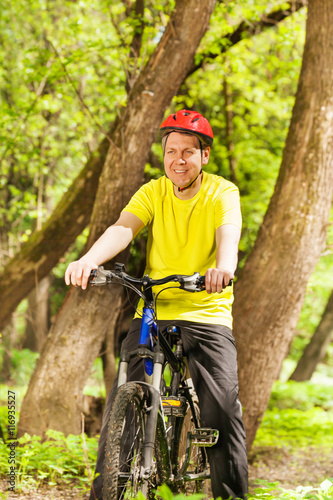 Fototapeta Naklejka Na Ścianę i Meble -  Portrait of active man riding his mountain bike