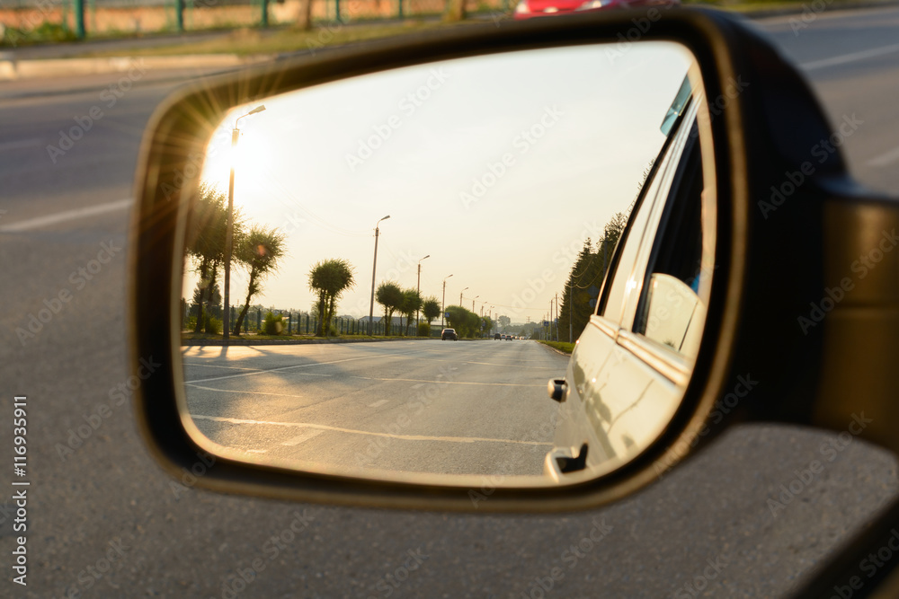 Reflection of a city street in the mirror car Reflection of a city street in the mirror car