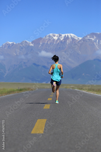 healthy lifestyle young fitness woman runner running on road © lzf