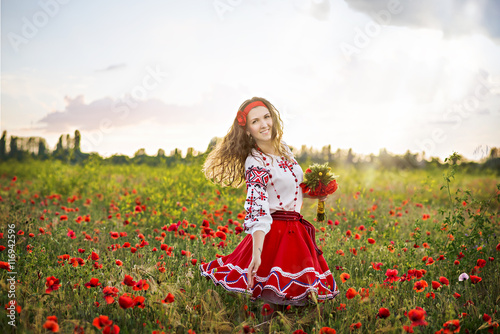 Ukrainian woman in the poppy field