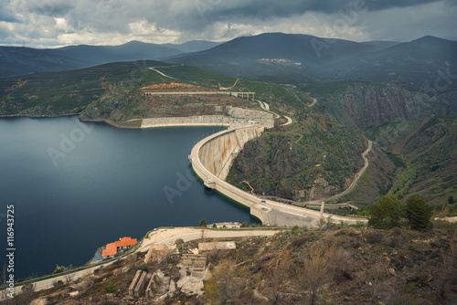 River And Dam Surrounded By Mountains View