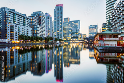 Illuminated buildings in Canary Wharf, financial hub in London at evening photo