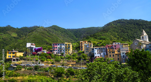 View of colorful village Corniglia, Cinque Terre region, La Spezia, Italy. Vineyards and houses.