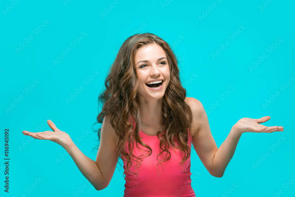 Fototapeta premium The young woman's portrait with happy emotions