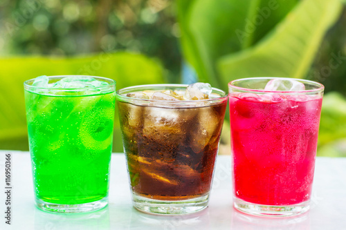 soft drink in a glass with ice cubes