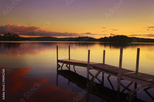 old pier in a lake at the sunset in maine - united states of america © benemale
