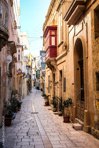 Fototapeta Naklejka Na Ścianę i Meble -  Valletta iconic narrow city streets at sunset
