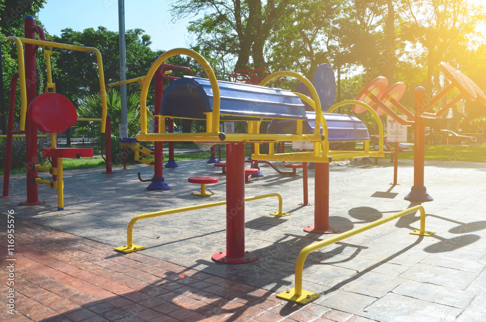 Colorful outdoor fitness gym in public park under sun light