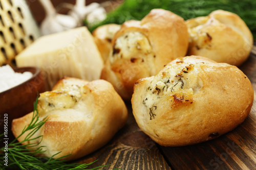 Baked buns stuffed with cheese and herbs