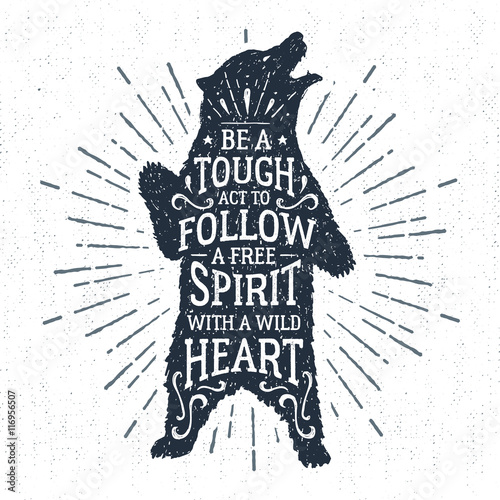 Hand drawn tribal badge with textured grizzly bear vector illustration and "Be a tough act to follow, a true spirit with a wild heart" lettering.