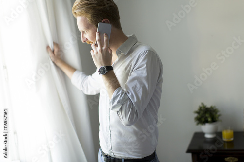Redhair man with phone in t...