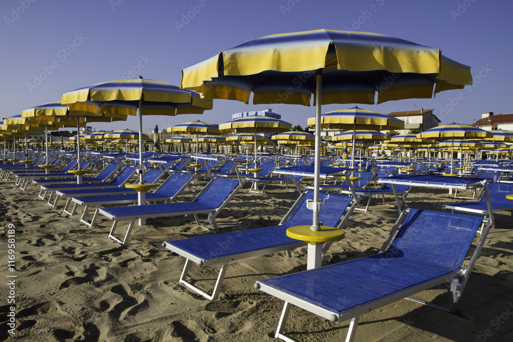 Adriatic beach umbrellas and sunbeds