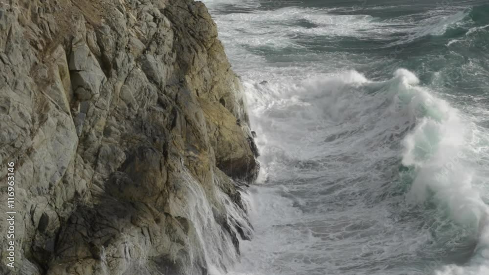 Wave Crashing onto the rocky shore of Pacific Ocean California Wave Crashing onto the rocky shore of Pacific Ocean California