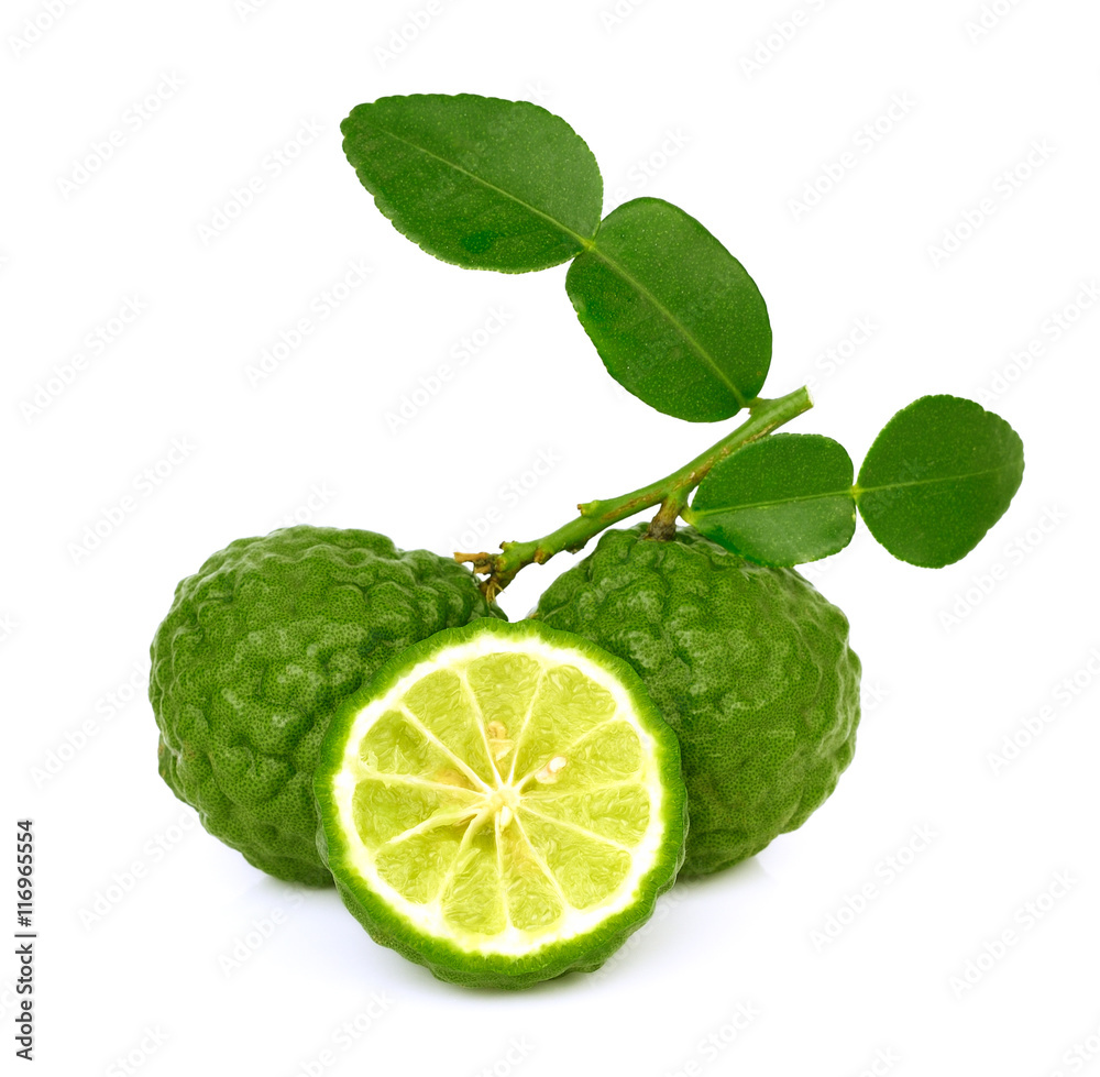 Fresh bergamot fruit with leaves on a white background.