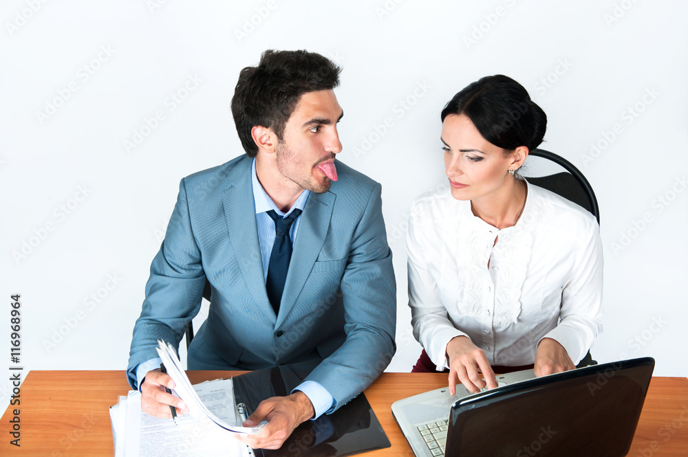 Businessman stuck out his tongue mimicking business woman Businessman stuck out his tongue mimicking business woman