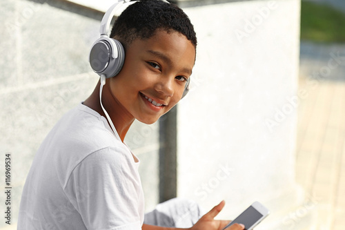 African American boy listen...