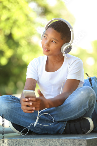 African American boy listen...
