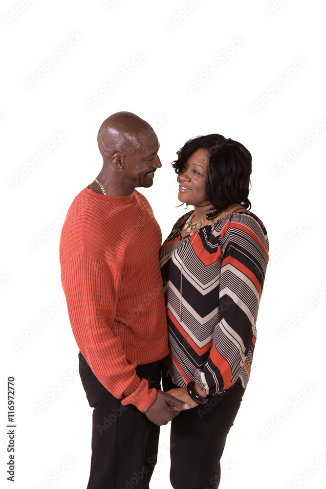 Fototapeta premium An african american couple being close isolated on white