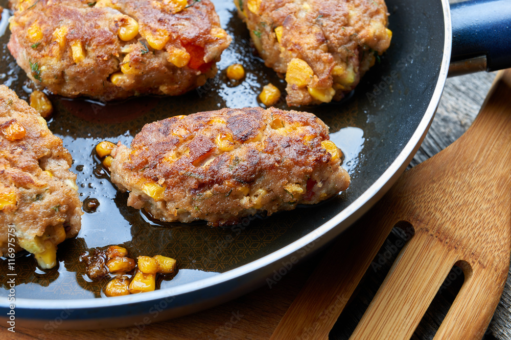Homemade meat and vegetable cutlets on frying pan