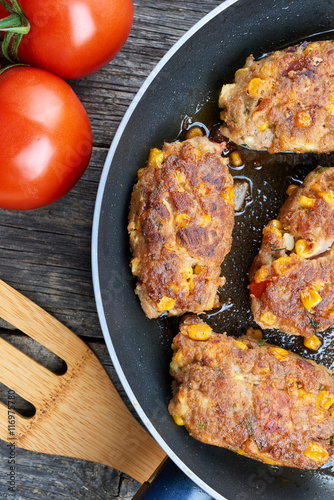 Homemade meat and vegetable cutlets on frying pan