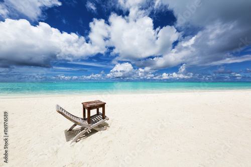 Chair and table on the white beach