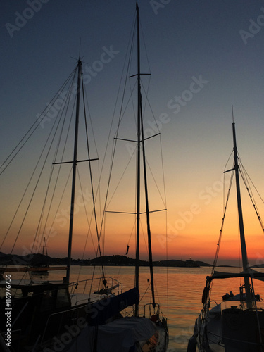 Silhouettes of yatch at marina © ellisia