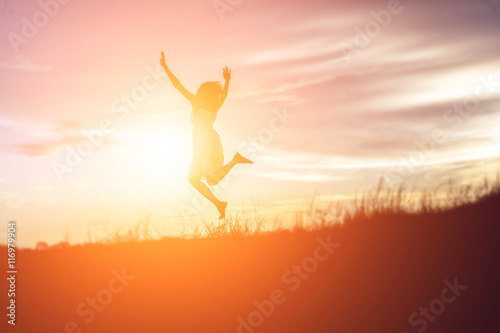 Silhouette of a beautiful girl jumping