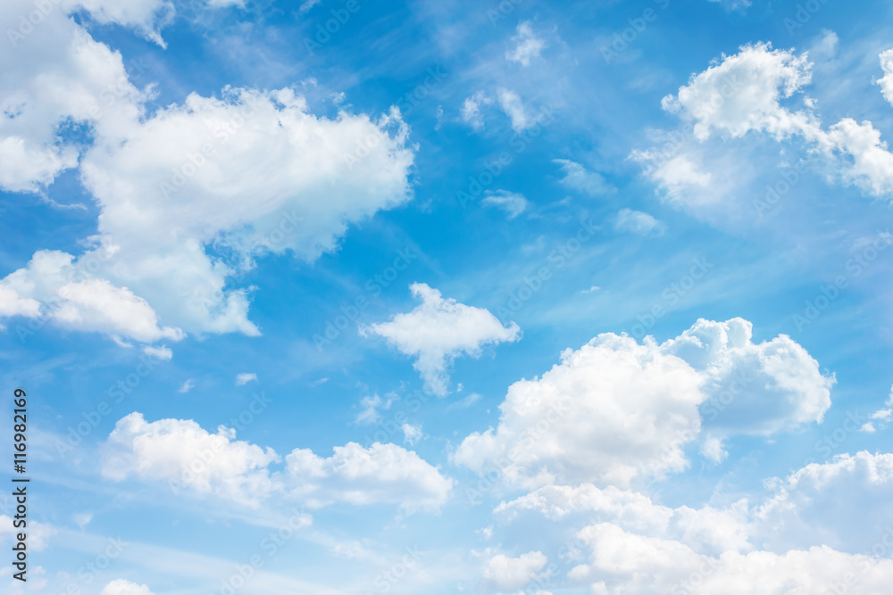 Puffy clouds on fresh cheerful blue sky Puffy clouds on fresh cheerful blue sky