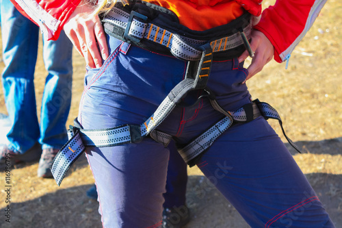 The woman is ready to belay climber